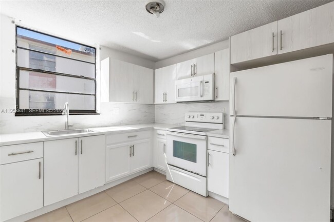 Building Photo - 1798 NW 55th Ave Unit 202