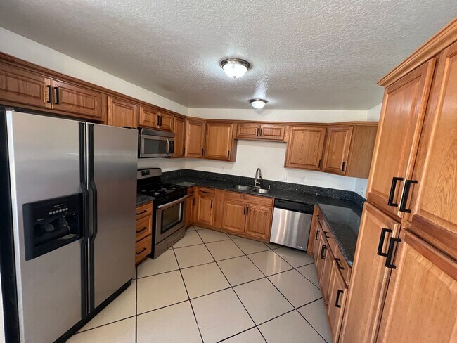 Photo - Move-In Ready Beauty with Granite Kitchen, Stainless Steel Appliances & Expansive Backyard
