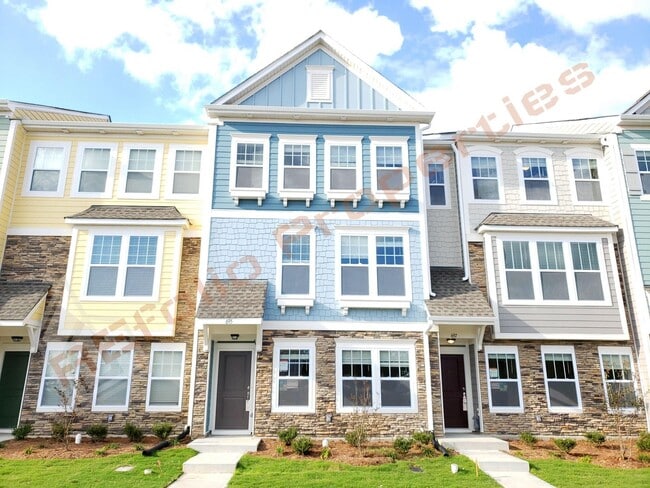 Building Photo - Beautiful Luxury 3 Story 3 Bedroom Townhome with 1st Floor Guest Suite, Attached 2 Car Garage, Co...