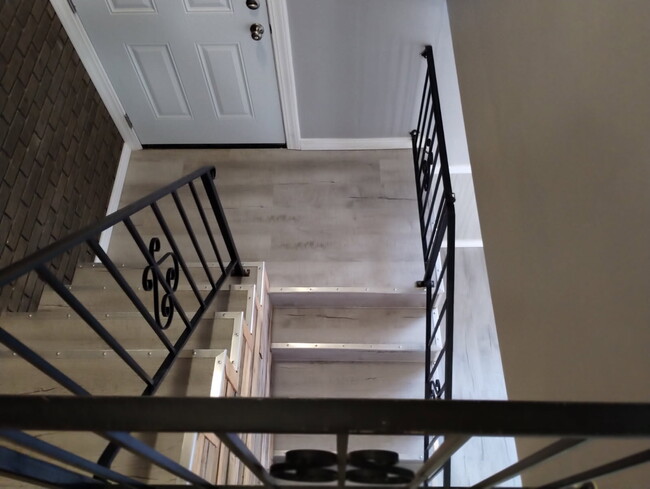 View from landing to foyer - 218 Castellano Dr Townhome