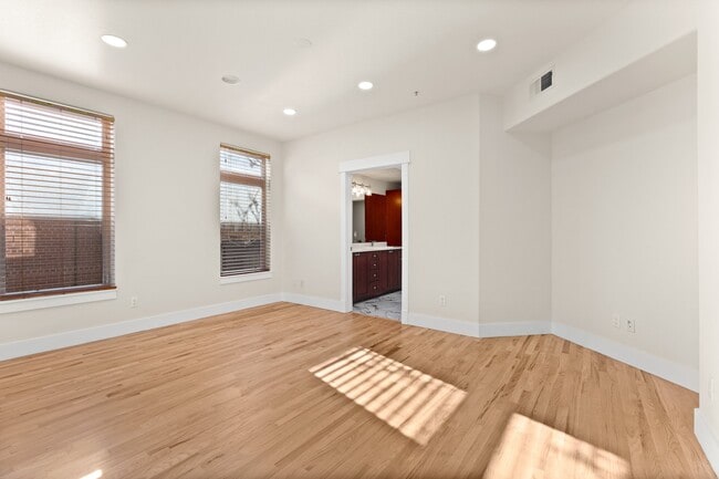 large primary bedroom with windows - 1080 E 13th Ave Unit 301