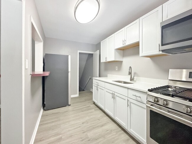 Photo - Updated 3BR Home with Bonus Lower-Level Space & Off-Street Parking