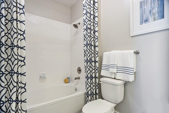 Bathrooms with tile surround showers and tubs