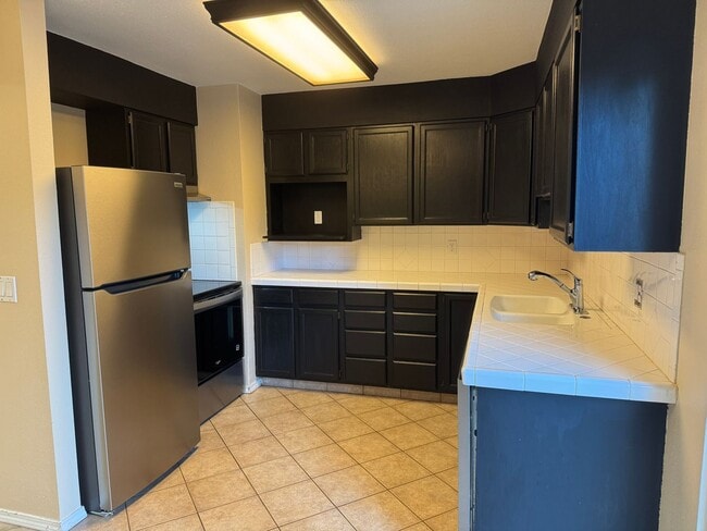 Photo - 3br/2ba house with finished basement, two car garage/shop and fully fenced yard