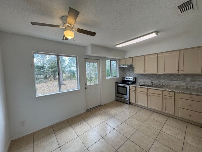 Photo - A Sun-Kissed Haven: 3-Bedroom Home with Room to Roam in Deltona!
