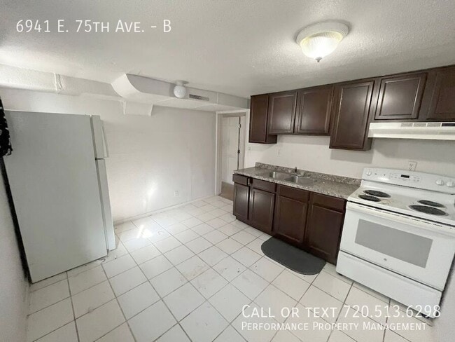 Building Photo - 6941 E 75th Ave Unit B