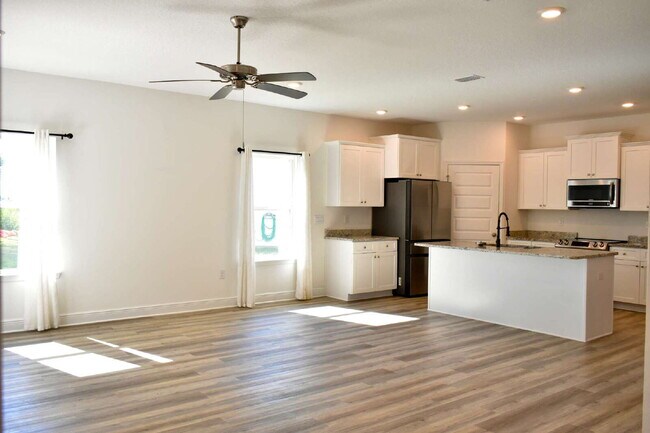 This gorgeous new construction home in Ward Creek overlooks a protected nature preserve.