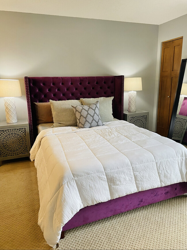 Purple upholstered bedframe with comfortable Nectar memory foam mattress - 433 S 7th St Condo Unit 1622