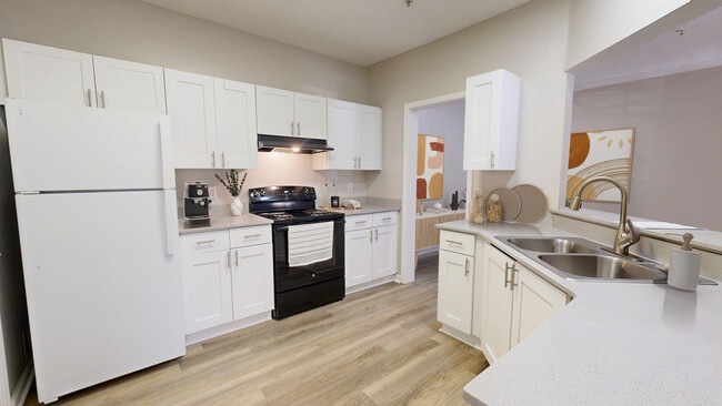 Bright, open kitchen with plenty of space to create and entertain. - Sugar Mill Apartments