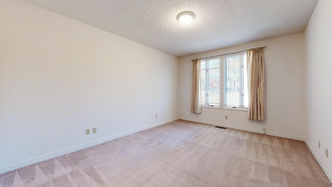 Photo - The Mylandia | Beautiful and spacious University City – Charlotte house with a backyard, offering...