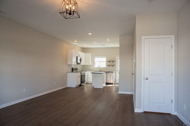 Large area to configure any way you'd like for dining & living, powder room, pantry & closet. - 110 Kathryn Ct