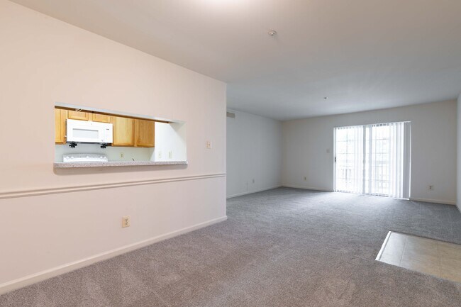 Courthouse Crossings - Living Room with View to Kitchen - Courthouse Crossings Apartments
