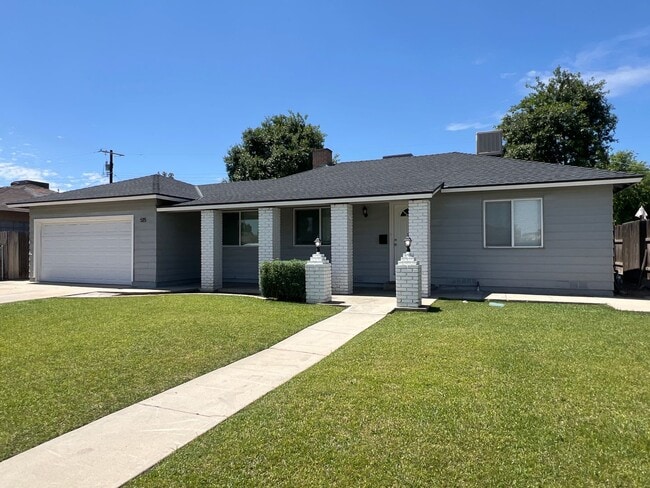 Building Photo - Remodeled 3 Bed Home w/ Fireplace, Garage & Huge Backyard – 93309