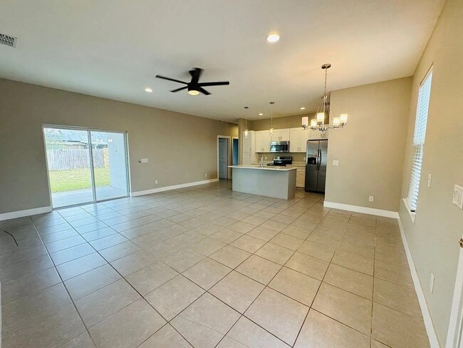 Photo - Beautiful New 3-Bedroom Home with Spacious Layout & 2-Car Garage in Poinciana Villages