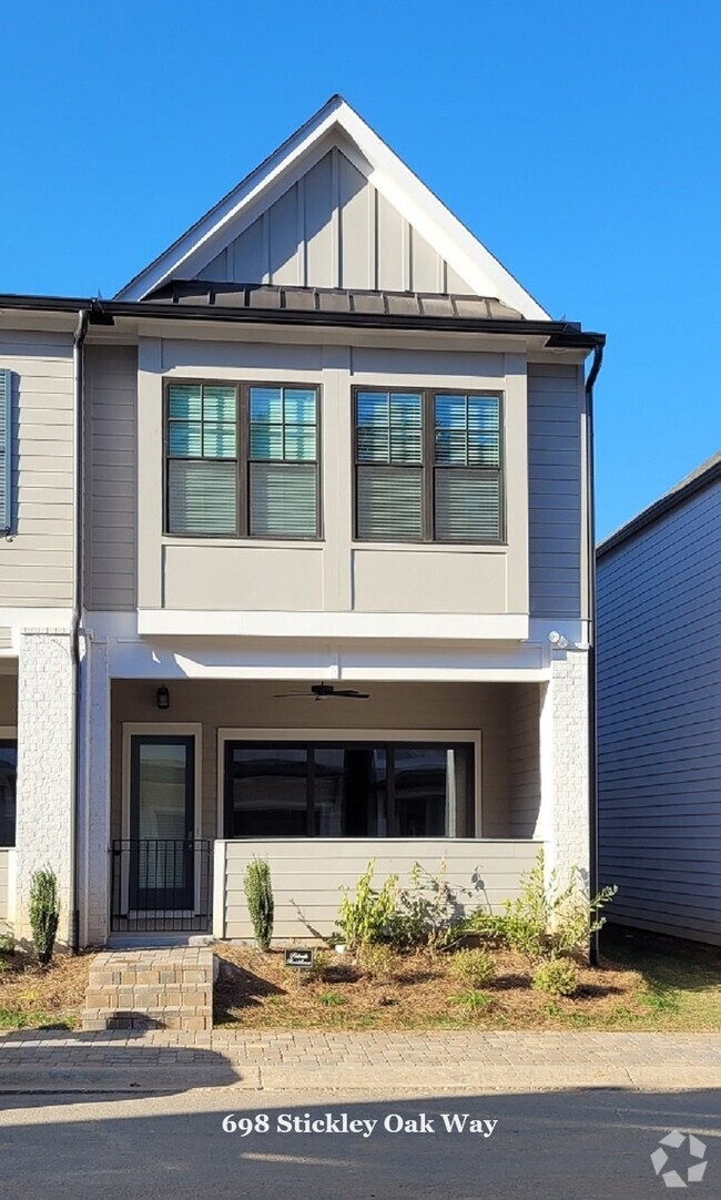Building Photo - End-unit townhome with plenty of extra win...