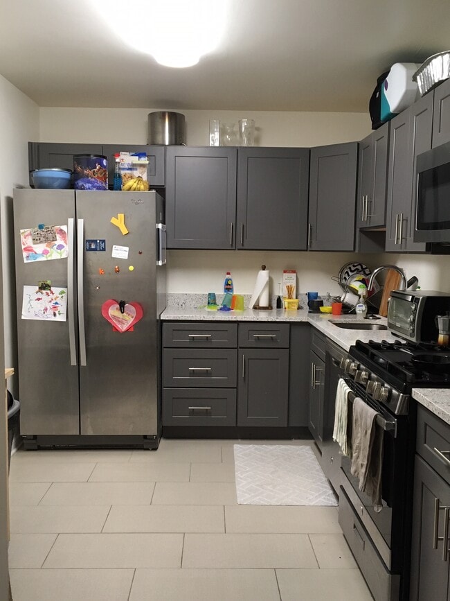 Renovated kitchen with quartz countertops - 5101 River Rd Unit 903