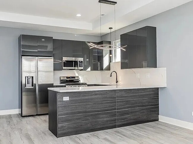 Building Photo - 2712 W 24th Pl Unit 1