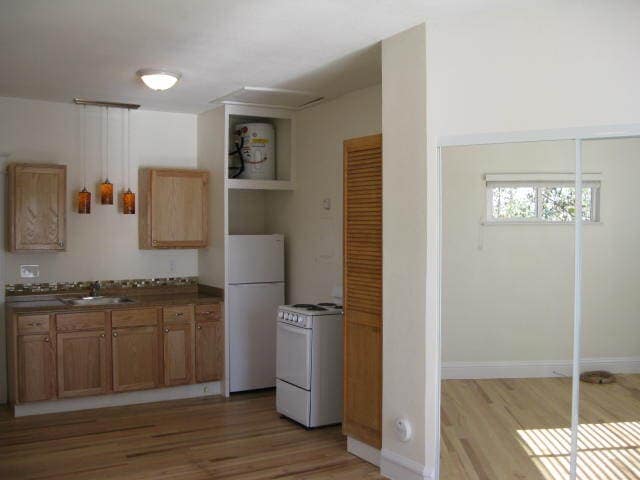 Kitchen shows pantry, oven and refrigerator - 1217 W 15th St