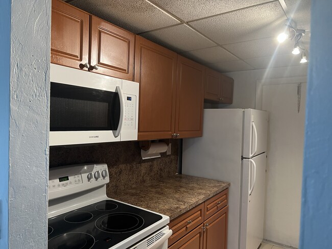 Building Photo - 13890 SW 90th Ave Unit HH107