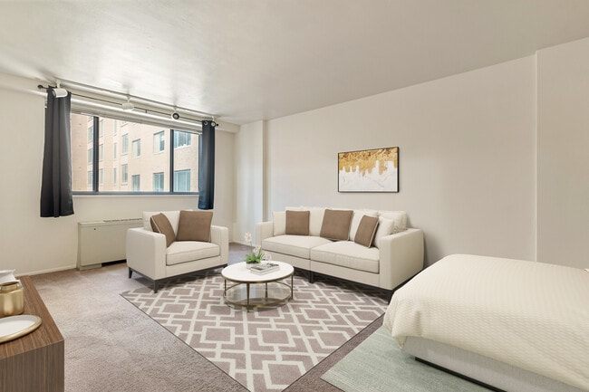 Bed and Living Room view from closet/bathroom Note: Carpet has been replaced with LVT Flooring - 1420 N St NW Unit 513
