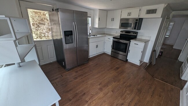 Kitchen refreshed cabinets - 203 Johnson St Unit #A