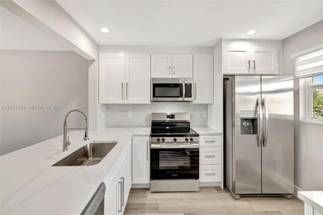 Building Photo - 6800 Royal Palm Blvd Unit 302F