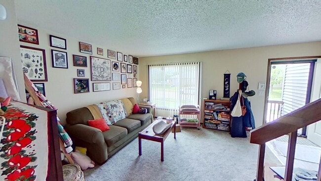Photo - 2 BR, 1.5 BA Clive split level duplex. Deck and one car attached garage.