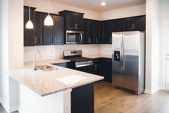 Photo - 4 Bed/ 3 Bath Townhome with Immediate Occupancy!