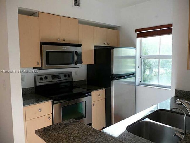 Building Photo - 2586 Centergate Dr Unit 207