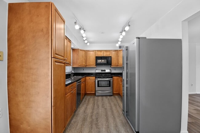 Photo - Welcome home to this light-filled, updated 4Bd/3.5Bth brick TH nestled in the sought-after Boniwo...