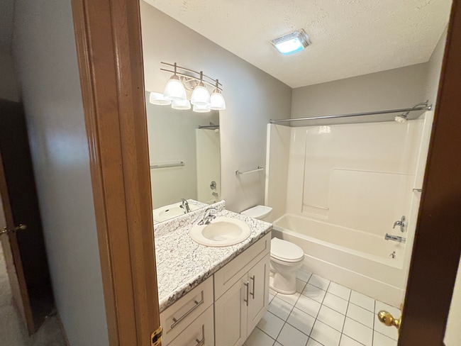 Photo - **$300 Off Move In Special** Spacious 3 Bedroom Townhome with Vaulted Ceilings, Fireplace & Attac...
