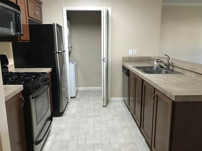 Kitchen and Pantry view from Foyer - 15054 NW Central Dr Unit 808