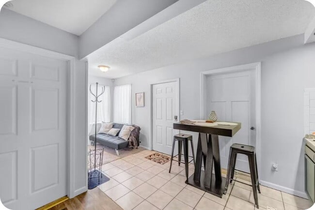 Photo - Furnished 1-Bedroom Apartment with Private Entrance and Free Laundry Unit 5