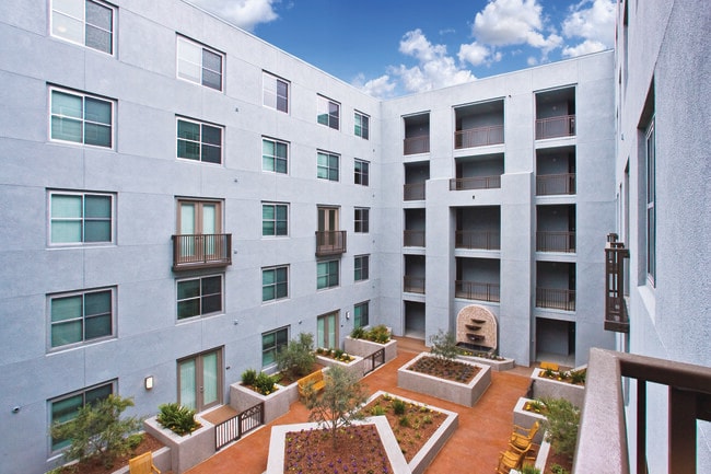 5 beautiful courtyards with water features, lush landscaping and outdoor lounge seating