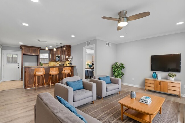 Living Room Virtually Staged with view of Kitchen - 5084 Matilda St Condo Unit 119