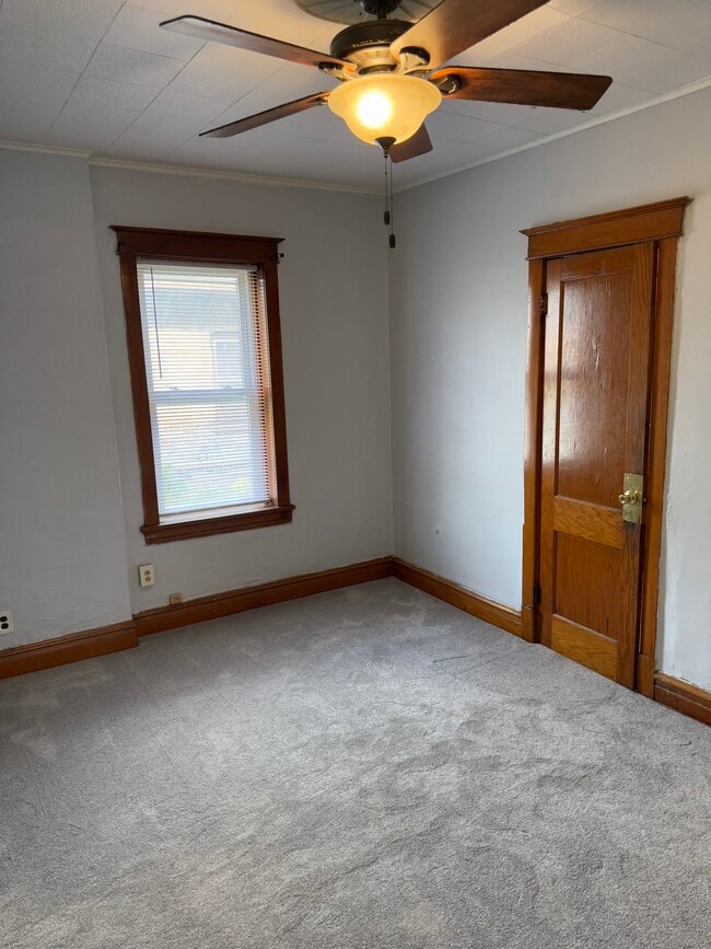 Large living room with hardwood build in shelves and all vintage hardwood - 2346 122nd St Unit One Rear
