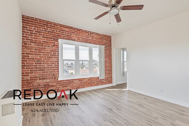 Photo - Studio with Exposed Brick Accent Wall, Lot... Unit 415