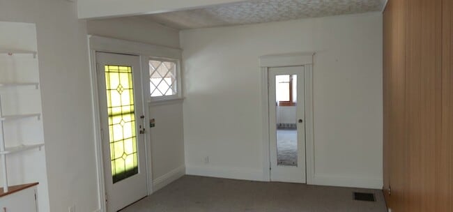 Main entrance door into living room. - 2504 Chili Ave Unit 2