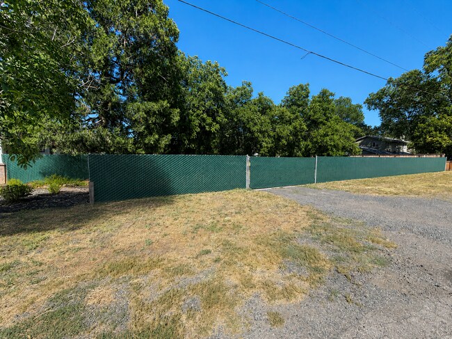 Photo - Private 3BR Home on Approx. 1 Acre | Huge Fenced Yard, Sunroom & 2-Car Garage