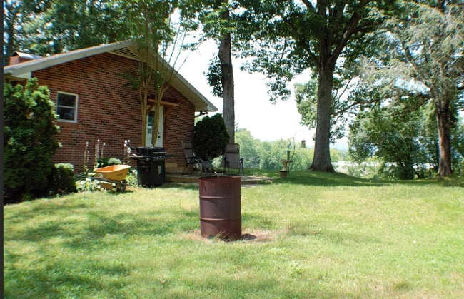 Photo - "Charming 3-Bed Retreat with Finished Basement & Fireplace in Scenic Mills River!" Furnished