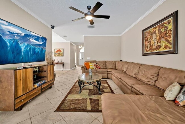 Photo - "Stunning 3BR Orlando Home with Private Screened Pool, Spa & Spacious Living Areas"
