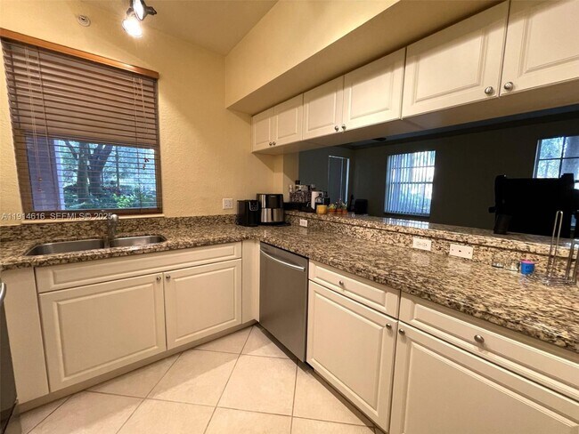 Building Photo - 6584 W Sample Rd Unit 6584