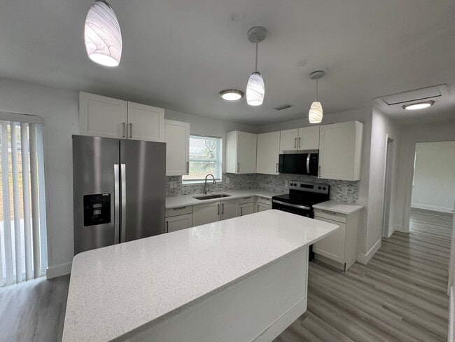 Photo - Recently Renovated 4/2 Home with Open Layout & Huge Backyard