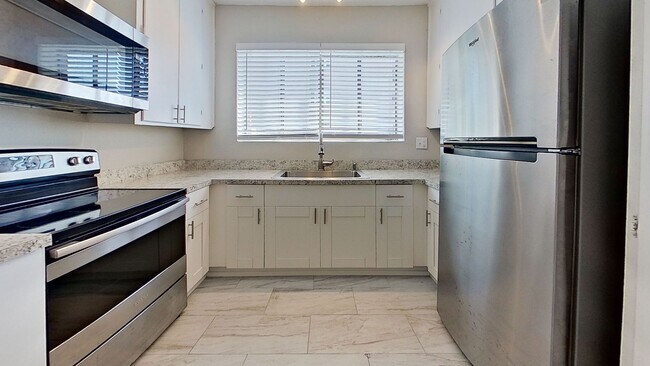 Photo - Riverfront Living! First Floor Unit w/ Private Patio, Stunning Views & Upgraded Kitchen