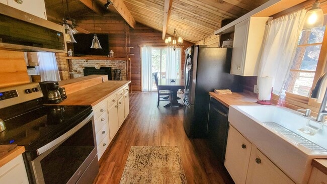 Photo - Move-In Ready 2-Bedroom Log Home with Wrap-Around Deck and Enclosed Yard