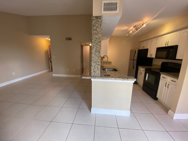 Building Photo - 2667 NW 33rd St Unit 2413 Rental
