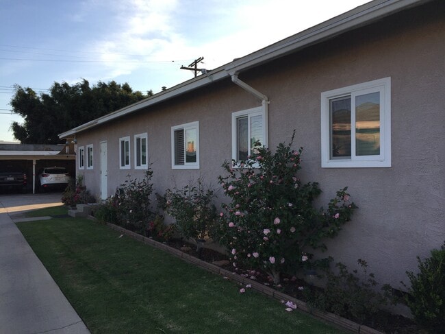 Side view of unit. Carport parking at rear of property.