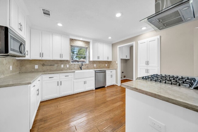 Photo - Welcome to this stunning 4-bedroom, 2.5-bath home on a quarter of an acre lot nestled in the high...