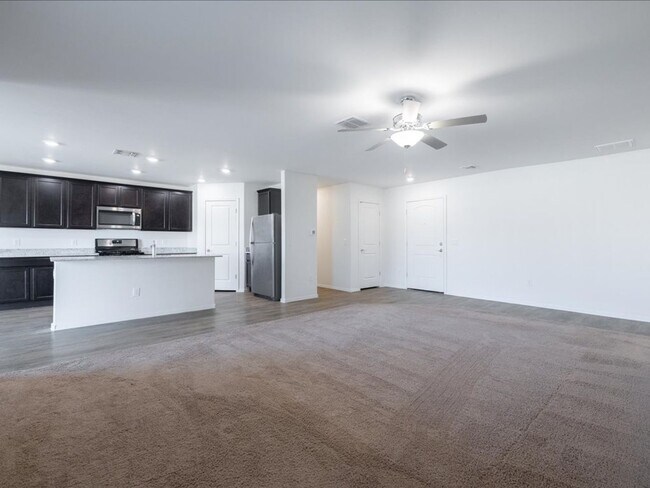 Photo - Spacious 4-Bedroom Home with Open Layout & Turf Backyard