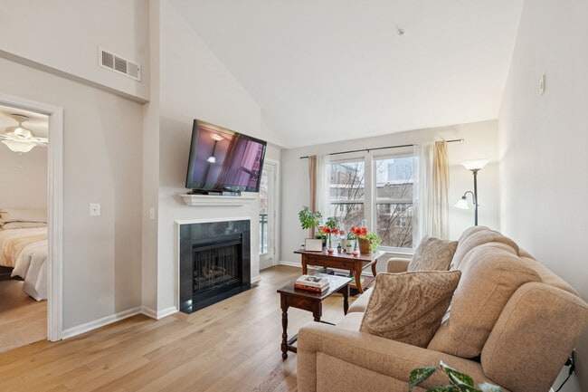 Bright, sunny living area with gas fireplace - 12000 Market St Unit 445